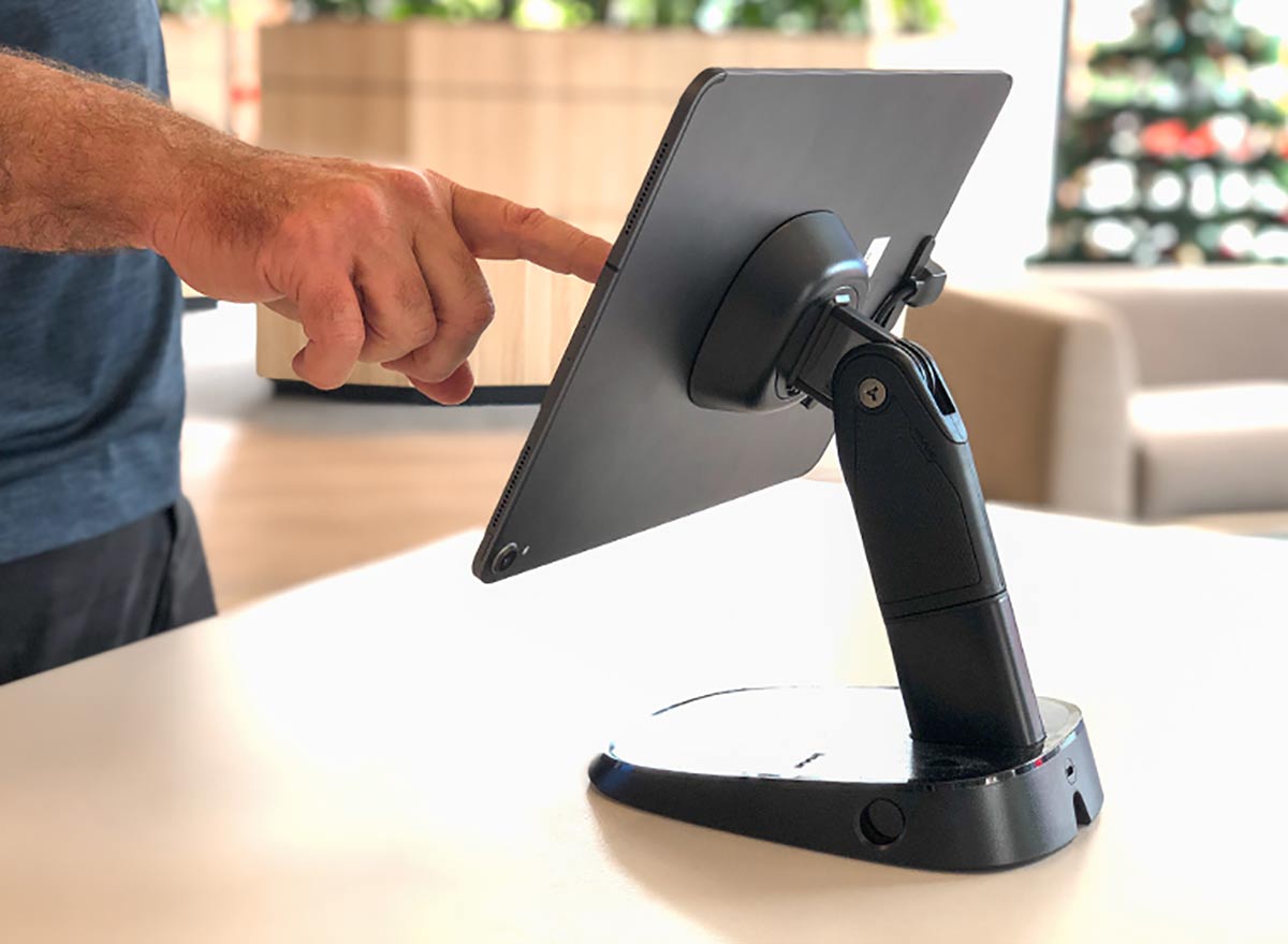 customer using tablet attached to a tablet stand in NAB , national Australia bank