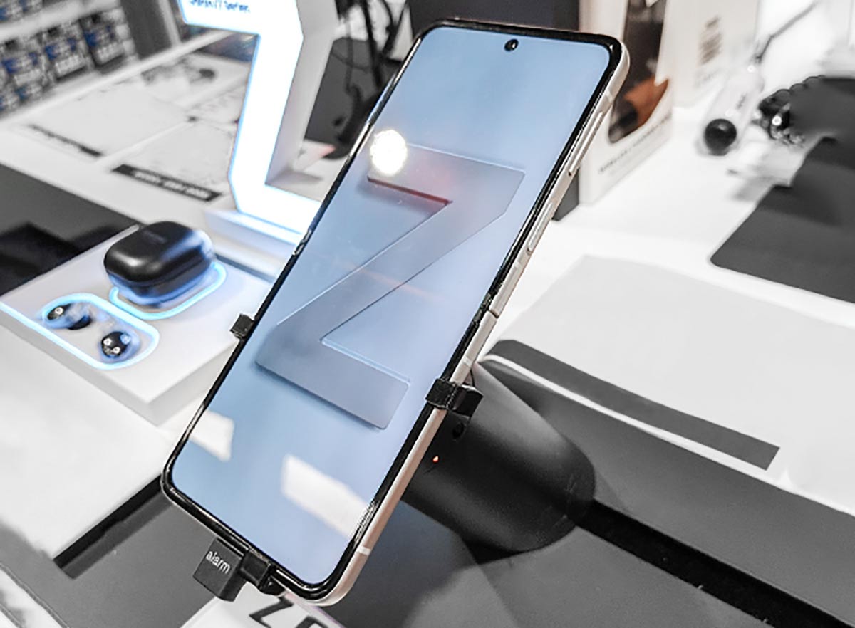 Samsung galaxy flip 3 phone, secured onto a custom security bracket by InVue, available through Sabel