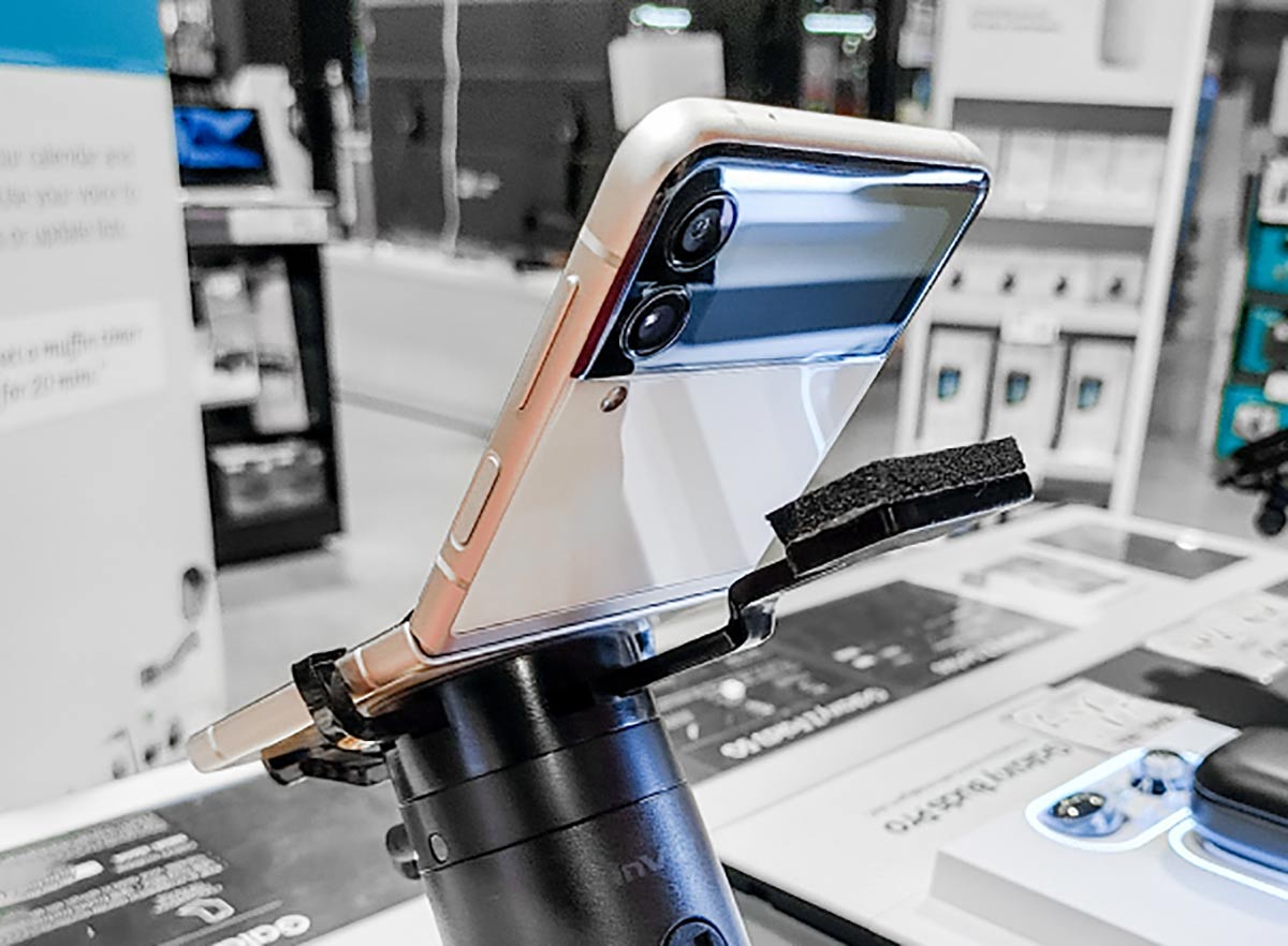 Samsung galaxy flip 3 phone, secured onto a custom security bracket by InVue, available through Sabel