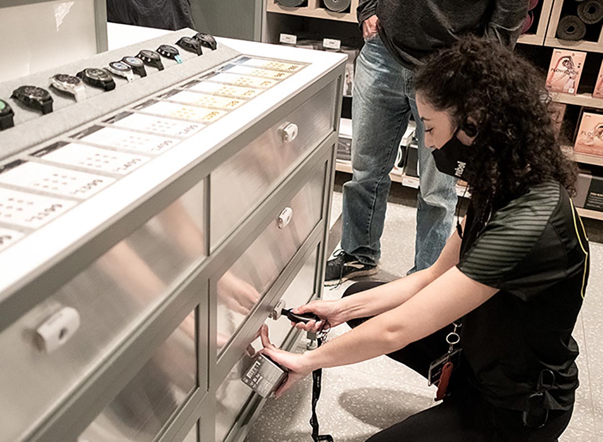 rebel highpoint melbourne, employee unlocking smart lock to open drawer