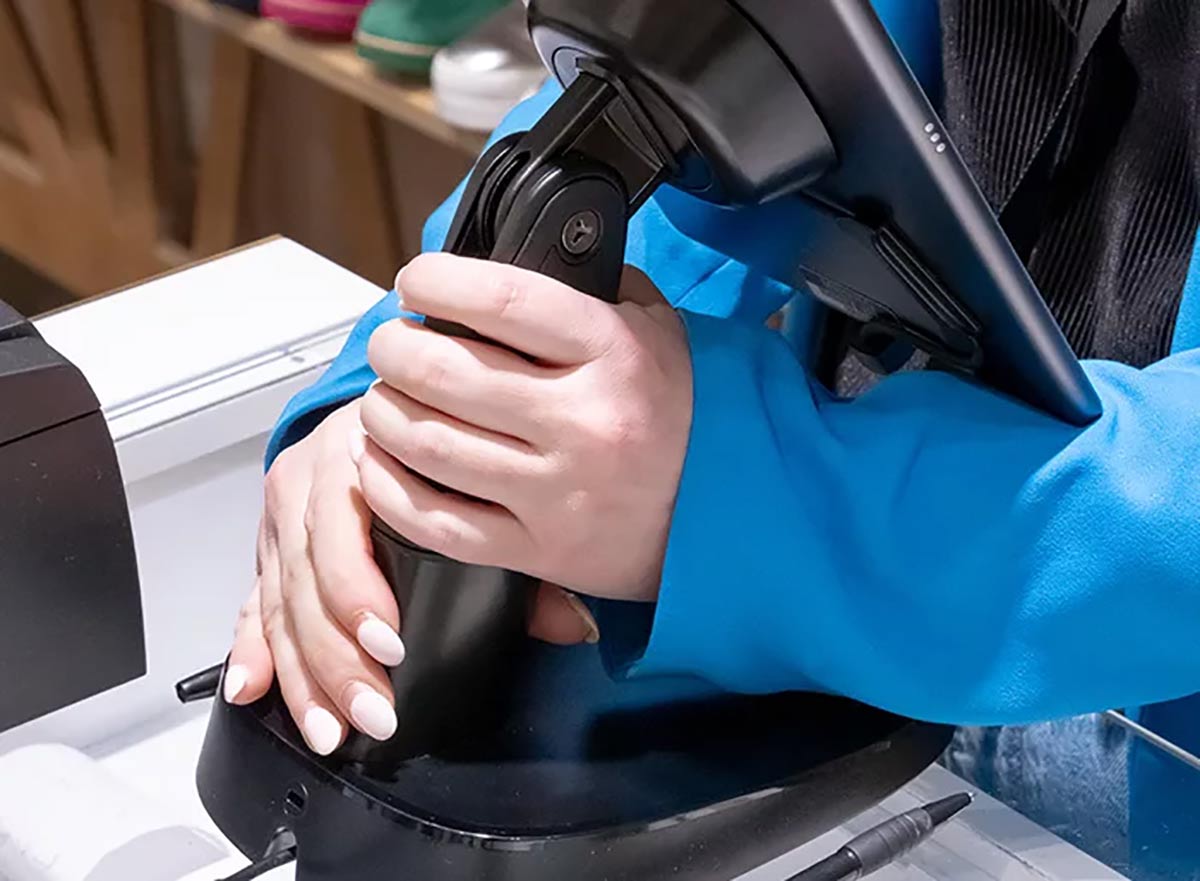 InVue CT150 tablet stand being made portable by Munro Footwear Group staff member