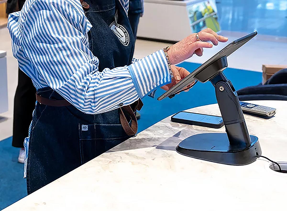 Tablet stand interaction instore at Munro Footwear Group