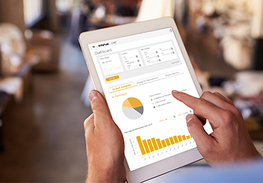 Person using dashboard of InVue LIVE platform on a tablet, LIVE Access, Product Management, retail