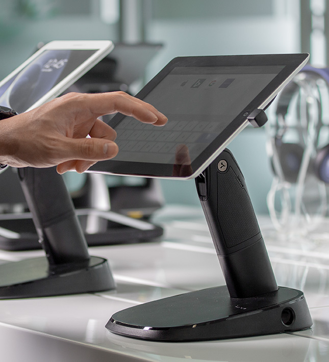CT150 portable tablet stand, locked down, person touching screen