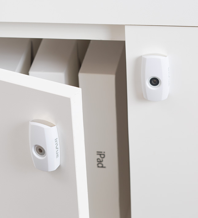 white cam lock, smart lock, open cupboard with ipads being protected from theft