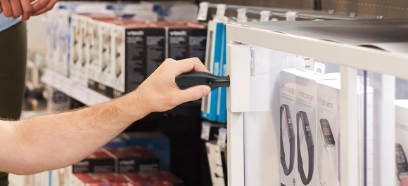 onekey unlocking digital lock to retrieve watches from glass cabinet