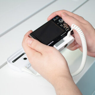 InVue Zips camera security, camera being held and tested in consumers hands