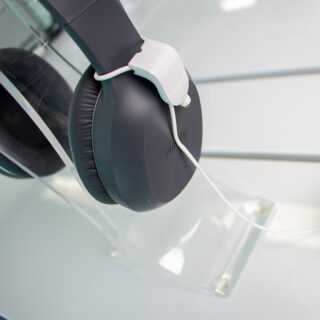 InVue Zips recoiler on close up of headphones