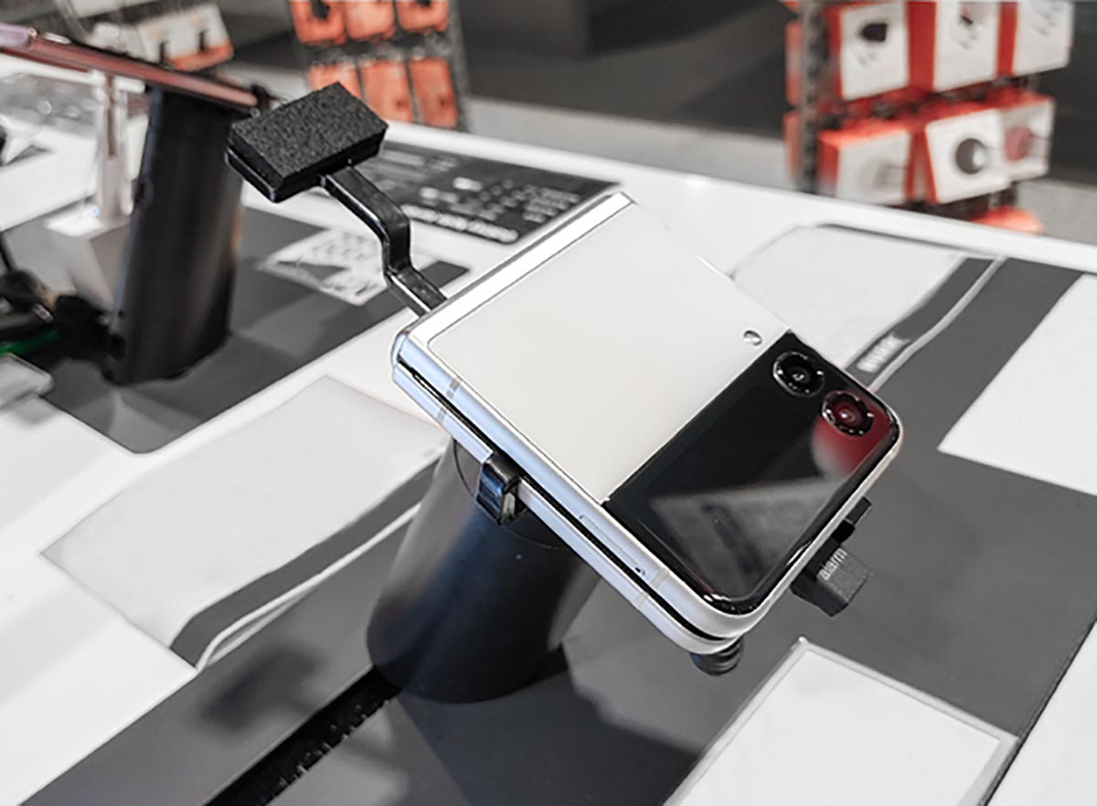 Samsung galaxy flip 3 phone, secured onto a custom security bracket by InVue, available through Sabel