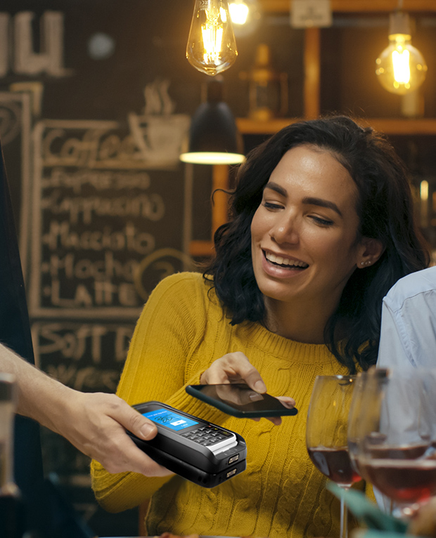 customer paying in restaurant with mobile phone