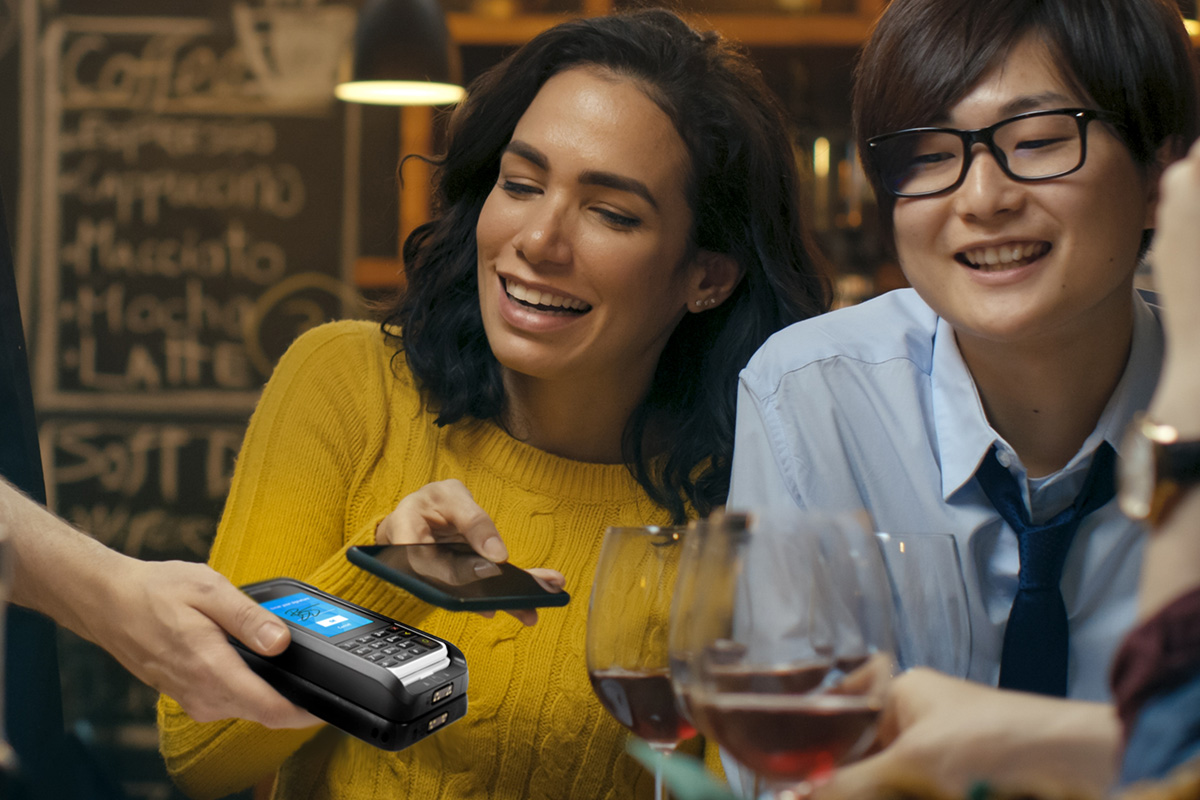 customer paying in restaurant with mobile phone