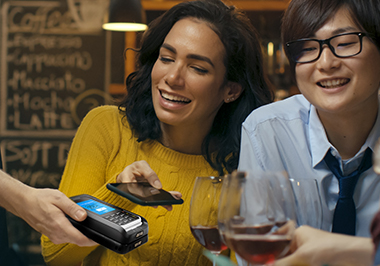 customer paying in restaurant with mobile phone