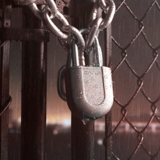 LIVE Digital Padlock, locked on outdoor security cage gates, getting wet in the rain, bad weather